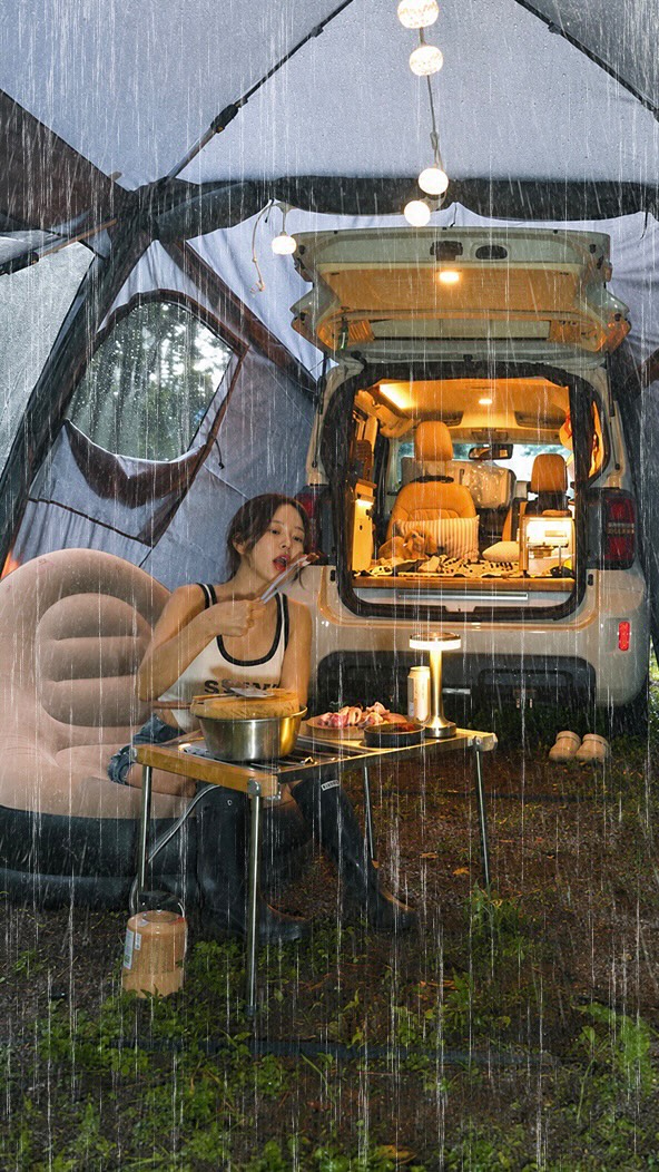 Rain falling around Ssoberry’s sheltered camping setup